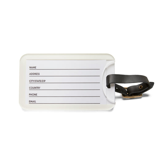 White luggage tag with black text field and leather strap on a white background
