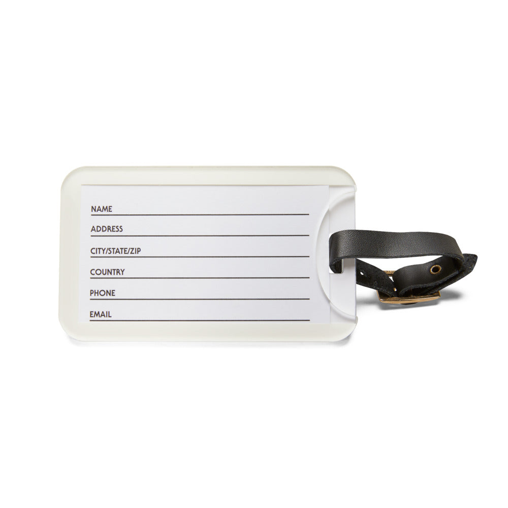 White luggage tag with black text field and leather strap on a white background